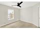 Bedroom featuring carpet flooring, ceiling fan, and window at 4722 Common View Cir, Indianapolis, IN 46220