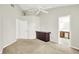 Light-filled room featuring neutral walls, a ceiling fan, a dark brown cabinet and a convenient bathroom entrance at 4722 Common View Cir, Indianapolis, IN 46220