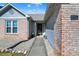 View of the front entrance and walkway of a single-story home with brick and vinyl exterior at 4722 Common View Cir, Indianapolis, IN 46220