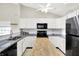 Bright kitchen featuring white cabinets, stainless steel appliances, granite countertops, and butcher block island at 4722 Common View Cir, Indianapolis, IN 46220