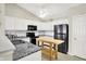 Stylish kitchen with white cabinets, stainless steel appliances, and a wooden kitchen island at 4722 Common View Cir, Indianapolis, IN 46220