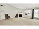 Open living room with neutral carpet, a fireplace, and sliding doors to the backyard at 4722 Common View Cir, Indianapolis, IN 46220