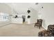 Open floor plan with a view of the kitchen from the spacious carpeted living room at 4722 Common View Cir, Indianapolis, IN 46220