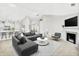 Bright and modern living room with a fireplace, neutral decor, and an open floor plan at 4722 Common View Cir, Indianapolis, IN 46220