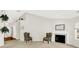 Bright living room featuring a fireplace, neutral walls, and charming floral armchairs at 4722 Common View Cir, Indianapolis, IN 46220