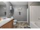 Well-lit bathroom features a single sink vanity and tub with shower, providing a clean and functional space at 4732 Ashfield Dr, Westfield, IN 46062