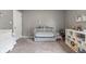 Neutral bedroom showcasing a crib and storage shelves, creating a versatile Bedroom space at 4732 Ashfield Dr, Westfield, IN 46062
