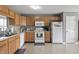Kitchen with bright cabinets, white appliances, and plenty of counter space at 4732 Ashfield Dr, Westfield, IN 46062