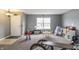 Spacious living room features carpet flooring, natural light, and ample space for a playroom or Gathering area at 4732 Ashfield Dr, Westfield, IN 46062