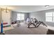 Open-concept living room with carpet, multiple windows, and ample space, perfect for entertaining and Gathering activities at 4732 Ashfield Dr, Westfield, IN 46062