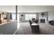 Spacious living room featuring a cozy fireplace and an open floor plan that connects to the dining area at 4732 Ashfield Dr, Westfield, IN 46062