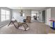 Neutral, carpeted living room with gray walls, lots of natural light, and an open floor plan at 4732 Ashfield Dr, Westfield, IN 46062