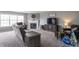 Inviting living room featuring neutral walls, a fireplace, and a large window at 4732 Ashfield Dr, Westfield, IN 46062