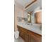 Neutral bathroom featuring a vintage wood vanity, white countertop, and decorative mirror at 477 S Restin Rd, Greenwood, IN 46142
