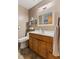 Bathroom features a single vanity, toilet, and neutral walls at 477 S Restin Rd, Greenwood, IN 46142