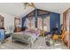 Bright bedroom with a high ceiling, large windows, and hardwood floors at 477 S Restin Rd, Greenwood, IN 46142