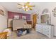 Bedroom featuring ceiling fan, dresser and some personal items at 477 S Restin Rd, Greenwood, IN 46142