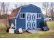 Outdoor shed for storage, featuring a rustic barn door, offering practical space for tools and equipment at 477 S Restin Rd, Greenwood, IN 46142