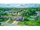Charming neighborhood aerial view with mature trees and well-manicured lawns, highlighting the home's location and curb appeal at 4889 Oakleigh Pkwy, Greenwood, IN 46143