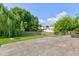 Spacious backyard with a large stamped concrete patio and fire pit, offering an ideal space for relaxation and outdoor gatherings at 4889 Oakleigh Pkwy, Greenwood, IN 46143