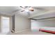 A carpeted basement space featuring neutral colored walls, and a brightly colored bed at 4889 Oakleigh Pkwy, Greenwood, IN 46143