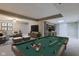 Finished basement featuring a pool table and a comfortable seating area at 4889 Oakleigh Pkwy, Greenwood, IN 46143