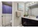 Bathroom featuring a single vanity with beach themed decor and shower with patterned curtain at 4889 Oakleigh Pkwy, Greenwood, IN 46143