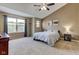 Bedroom boasts a vaulted ceiling, carpeted floors, and an abundance of natural light from the large window at 4889 Oakleigh Pkwy, Greenwood, IN 46143