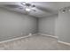 Empty bedroom featuring neutral colored walls and carpet, and a modern ceiling fan at 4889 Oakleigh Pkwy, Greenwood, IN 46143