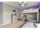 A well decorated bedroom features a wooden dresser, loft bed with gray couch, and blue led accent lighting at 4889 Oakleigh Pkwy, Greenwood, IN 46143