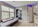 Bedroom with unique lighting, cozy carpet, a large window, and a mirrored closet at 4889 Oakleigh Pkwy, Greenwood, IN 46143
