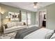 Bright bedroom with French doors leading to outdoor space and an ensuite bathroom at 4889 Oakleigh Pkwy, Greenwood, IN 46143