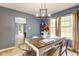 Cozy dining room with hardwood table and window providing natural light at 4889 Oakleigh Pkwy, Greenwood, IN 46143