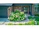 Charming brick home front entrance with a well-manicured garden and modern door, enhancing curb appeal at 4889 Oakleigh Pkwy, Greenwood, IN 46143