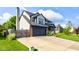 Attractive two-story home with a paved driveway and attached two-car garage at 4889 Oakleigh Pkwy, Greenwood, IN 46143