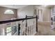 Hallway features a staircase with black and white banister at 4889 Oakleigh Pkwy, Greenwood, IN 46143