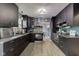 Modern kitchen with stainless steel appliances and sleek dark cabinetry at 4889 Oakleigh Pkwy, Greenwood, IN 46143