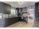 Modern kitchen with stainless steel appliances and breakfast bar at 4889 Oakleigh Pkwy, Greenwood, IN 46143