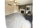 Inviting living room featuring plush carpeting and a classic fireplace at 4889 Oakleigh Pkwy, Greenwood, IN 46143