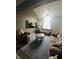 Bright living room showcasing a vaulted ceiling, plush seating, and natural light at 4889 Oakleigh Pkwy, Greenwood, IN 46143