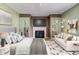 Relaxing main bedroom with fireplace, closet, and comfortable furnishings at 4889 Oakleigh Pkwy, Greenwood, IN 46143