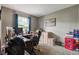 Home office featuring a wooden desk, a leather chair, and an Indianapolis Colts poster on the wall at 4889 Oakleigh Pkwy, Greenwood, IN 46143