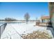 Backyard with sunroom addition, deck, and views of pond at 5316 Twin Bridge Blvd, Indianapolis, IN 46239
