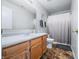 Bright bathroom featuring a wood vanity, and neutral shower curtain at 5316 Twin Bridge Blvd, Indianapolis, IN 46239