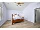 Bright bedroom with high ceilings, ceiling fan, light-colored walls, and a window with shutters at 5316 Twin Bridge Blvd, Indianapolis, IN 46239