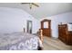 Bedroom featuring hardwood floors, ceiling fan and wood furniture at 5316 Twin Bridge Blvd, Indianapolis, IN 46239