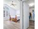 Bedroom with large window, ceiling fan, and en-suite closet at 5316 Twin Bridge Blvd, Indianapolis, IN 46239