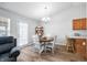 Bright dining area showcasing a round wooden table and an open doorway at 5316 Twin Bridge Blvd, Indianapolis, IN 46239