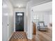 Inviting foyer featuring wood floors and a modern front door design at 5316 Twin Bridge Blvd, Indianapolis, IN 46239