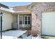 Inviting front porch featuring brick, neutral siding, and well-manicured landscaping at 5316 Twin Bridge Blvd, Indianapolis, IN 46239